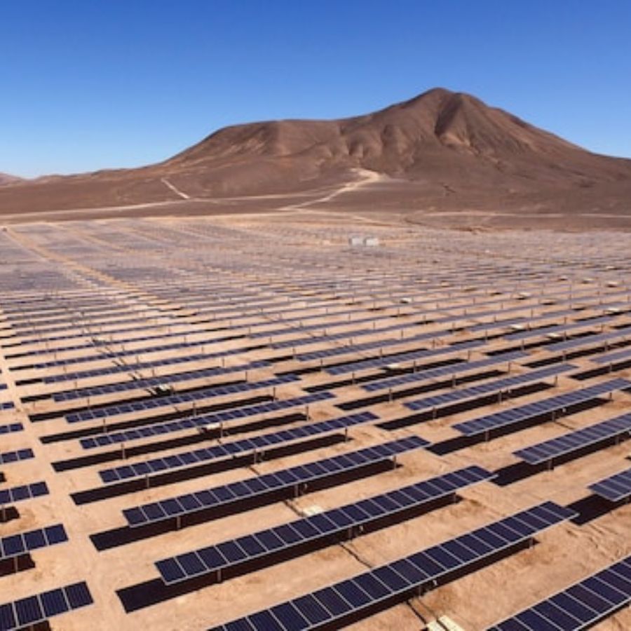 a large solar project by an energy cooperative below a mountain